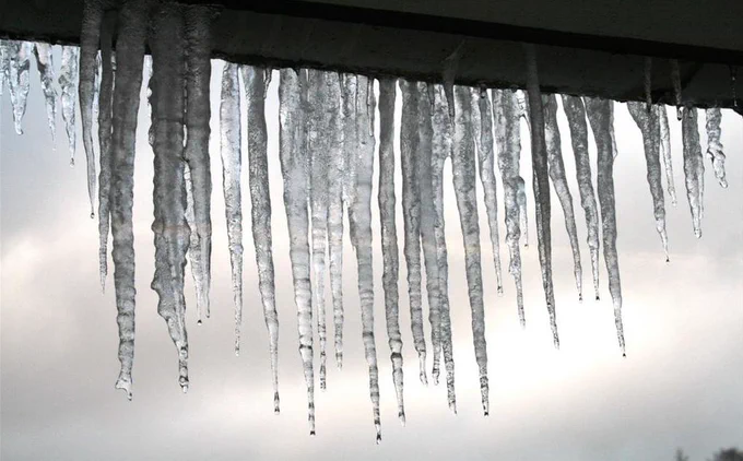 Icicles hanging from roof.
