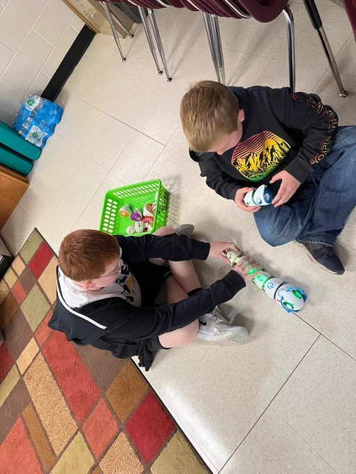 Cooperating to build a code  