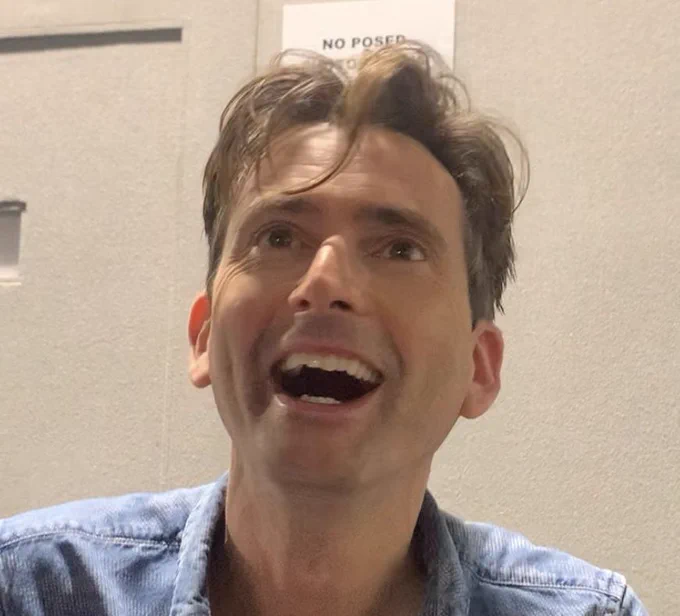 David Tennant looking up at a fan with the biggest happy smile on his face. A happy boy! 