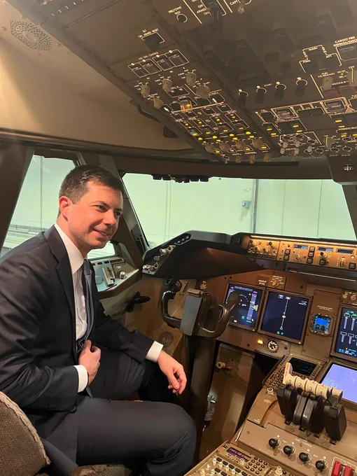 Secretary Buttigieg sits in the pilot seat of a UPS Cargo jet on a tour of UPS Worldport.