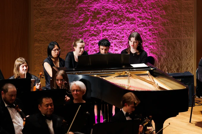 Four pianists play Lavignac's "Galop-Marche" together on one piano during Purdue Fort Wayne's Home for the Holidays concert.