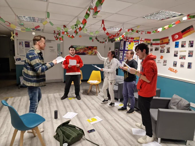 Residents and Choir Director Iori singing Christmas songs at The Wallich Julian Hodge Hostel