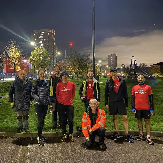 N.B.  The image is of 8 adults gathered together at night time for a group photo in a park.