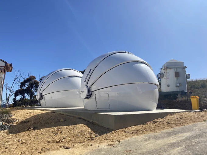 GOTO-South site now featuring two telescope domes. ROTSE in the background