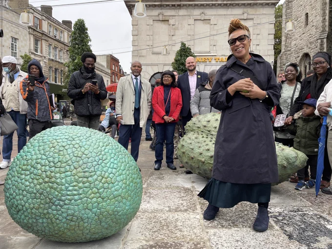Turner Prize winner Veronica Ryan OBE with marble and bronze Custard Apple, Breadfruit and Soursop sculptures at the Hackney unveiling in October 2021.