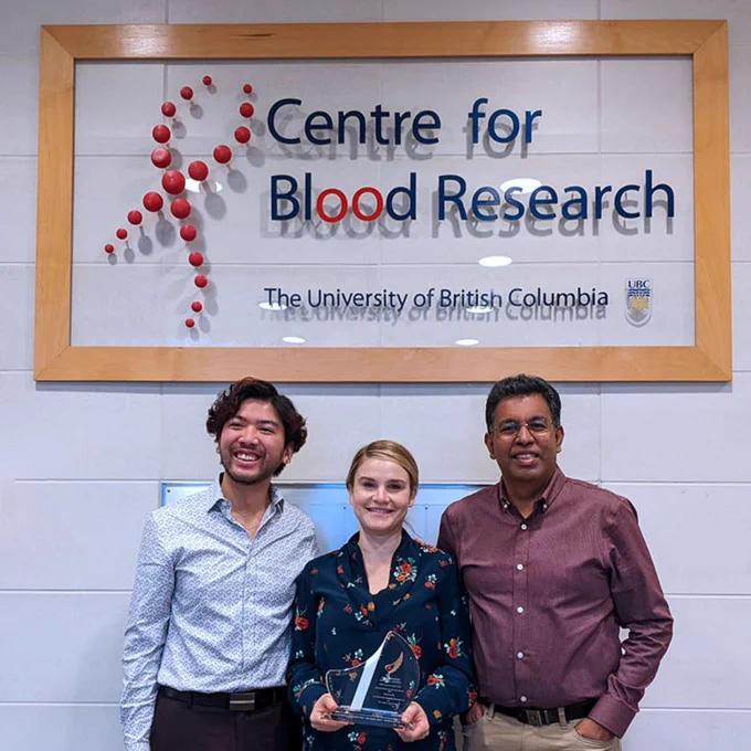 Recipients of the Logan Boulet Humanitarian Award 2021 holding the award. (Left to right: Daniel Luo, Dr. Erika Siren, Dr. Jayachandran Kizhakkedathu)