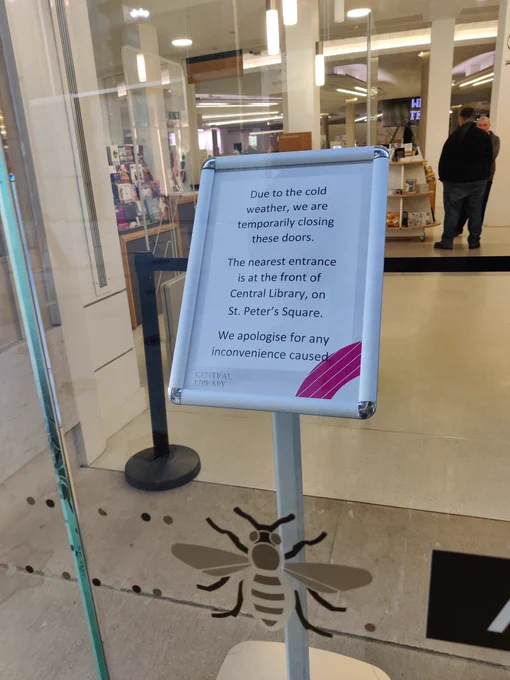 A sign saying the side door into Manchester Central Library - through the controversial Library Walk link building - is closed due to cold weather