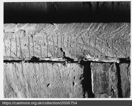 Vertical lines carved into stone 