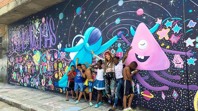“Soñemos Más” or “Let’s Dream More” is one of the many murals completed in the Aguablanca district in Cali, Colombia.