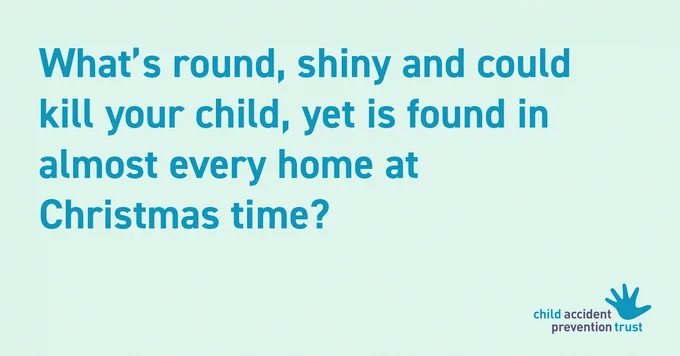 Green background with blue text that reads: What’s round, shiny and could kill your child, yet is found in almost every home at  Christmas time?