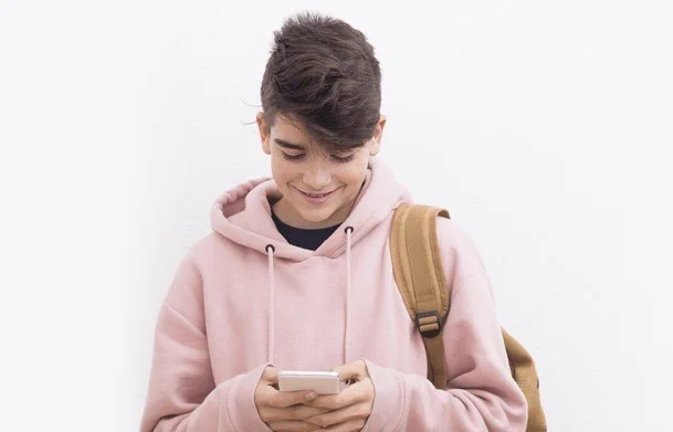 a photo of a young person using a smartphone