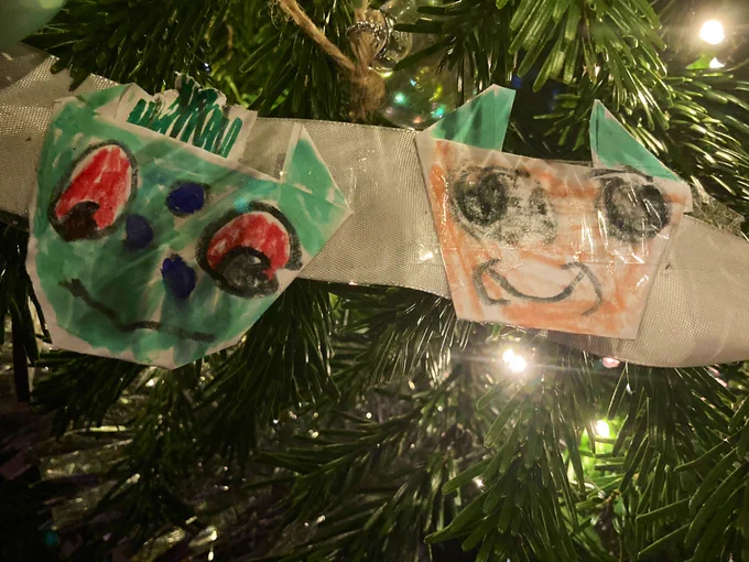 A tree garland made by Flo of paper Pokémon characters on a silver grey ribbon.