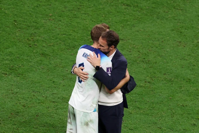 Harry Kane and Gareth Southgate embrace after the defeat to France.