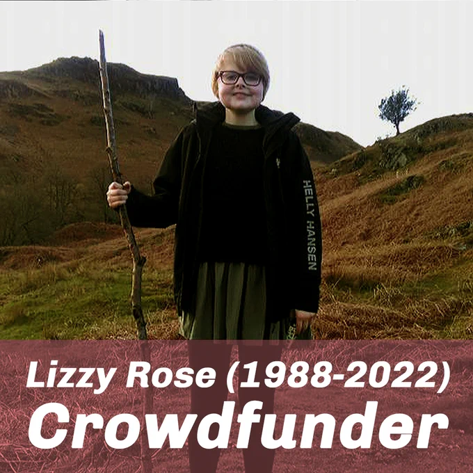 A photograph of Lizzy in a woolly hat and black puffa jacket, smiling triumphantly at the camera whilst holding a large walking stick, in front of a mountain, overlaid with text that reads "Lizzy Rose (1988-2022) Crowdfunder"