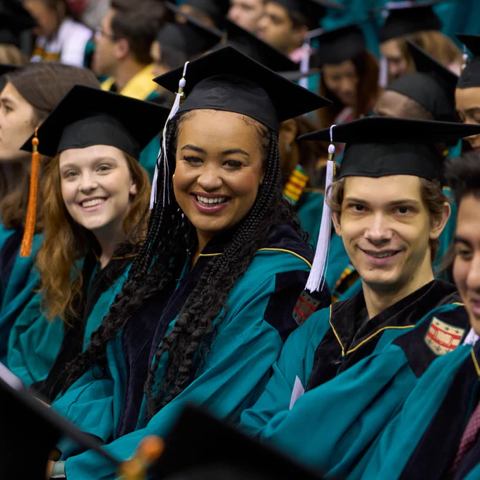 #WashU22 graduates smiling during WashU's December Recognition Ceremony.