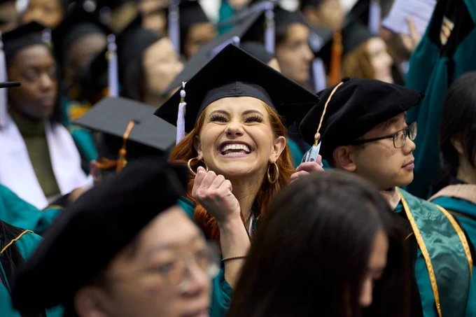 #WashU22 graduate smiling during WashU's December Recognition Ceremony.
