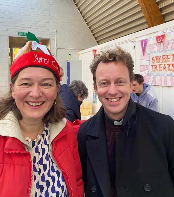 Fleur in a Christmas hat with Rev Brutus