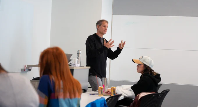 An instructor teaching a group of working professionals