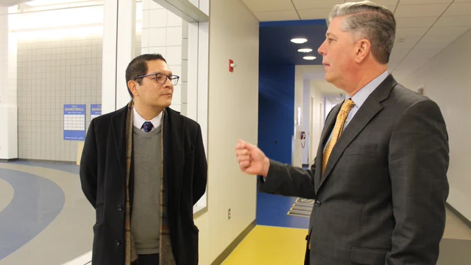 President Barry Maloney chats with Commissioner Ortega inside the Wellness Center during a tour of campus on Dec. 9, 2022.  