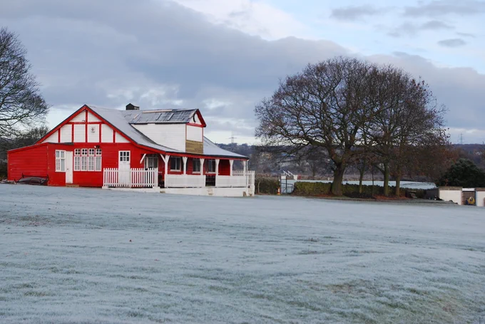 A winter scene: picture of the cricket club pavilion with frost on the ground