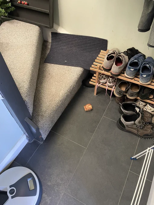 A sausage roll left at the bottom of the stairs.