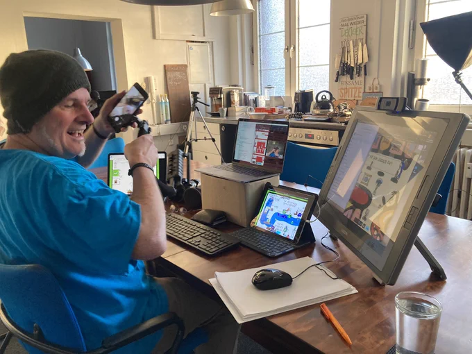 friedel at his desk. a lot of monitors