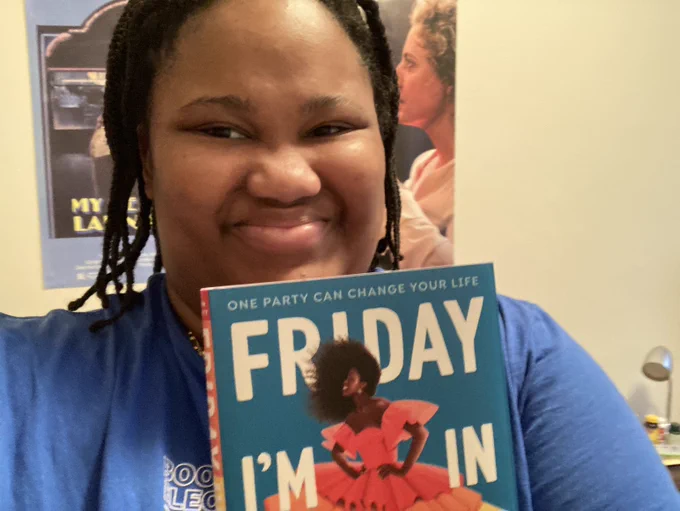 Me posing with a copy of fRIDAY I'M IN LOVE