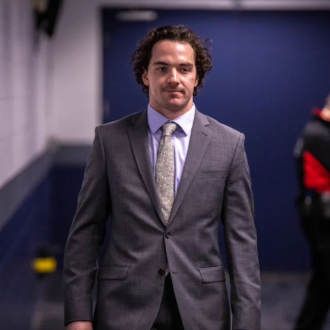 Michael Eyssimont arrives at Canada Life Centre in a suit.