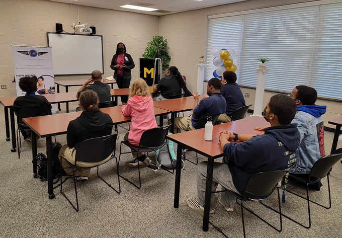 Mrs. Renee Mallory has a conversation with a student.