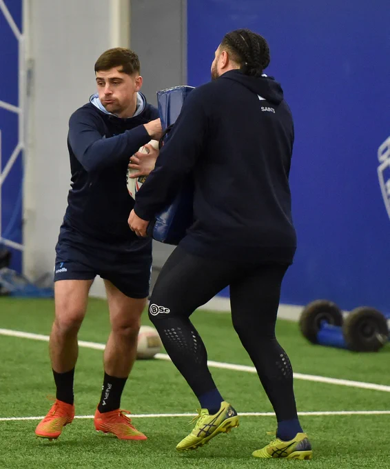 Lewis Dodd runs at Konrad Hurrell with the ball.