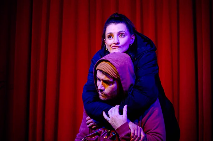 Tom Swift and Morven Robinson perform Shallow by Jeremy Fletcher. Two friends dressed for the cold hug.
