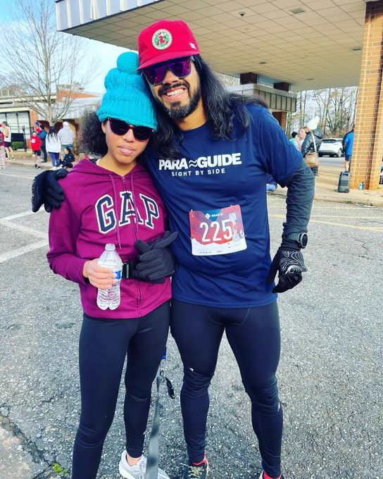Alana and Jesus pose together and are bundled up for the 5k