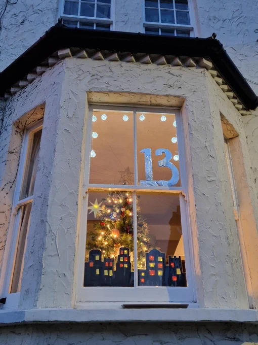 House with advent decorations in window 