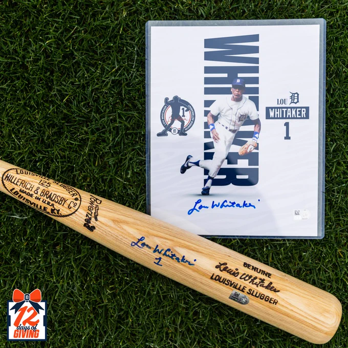 Closeup of autographed Lou Whitaker bat inscribed with numeral 1 and autographed photo featuring jersey retirement logo