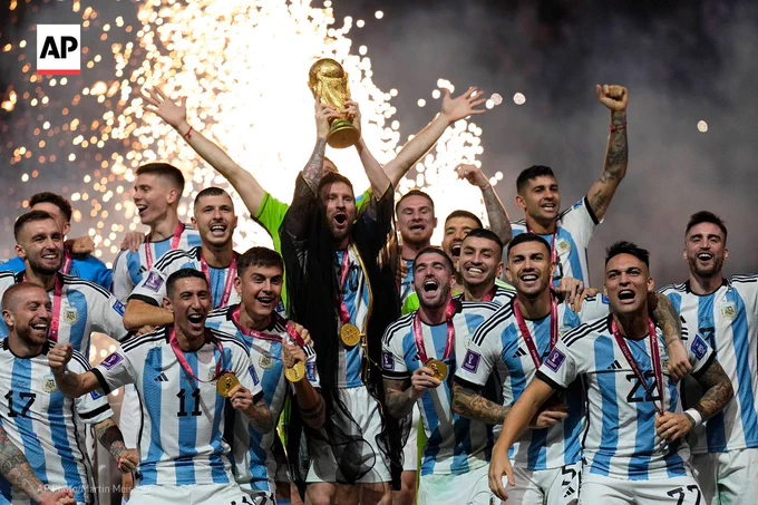 Argentina's Lionel Messi lifts the trophy after winning the World Cup final between Argentina and France. 