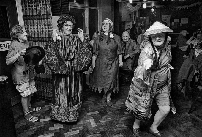 Christmas party at a pensioners’ lunch club.
St Hilda's, Club Row. Tower Hamlets. 1975