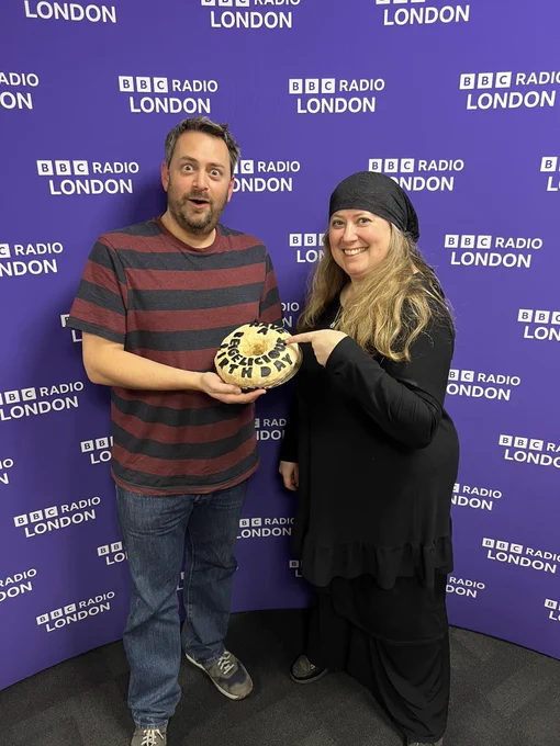 Comedians Philip Simon & Rachel Creeger with Philip’s birthday cake at BBC London Radio