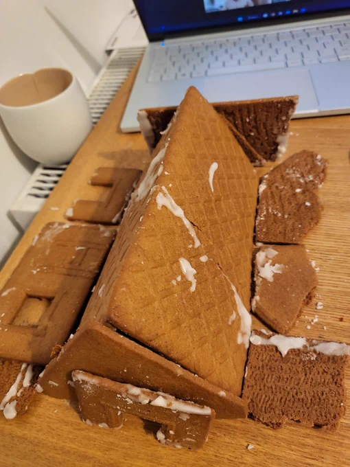 Photo of a gingerbread house partially collapsed