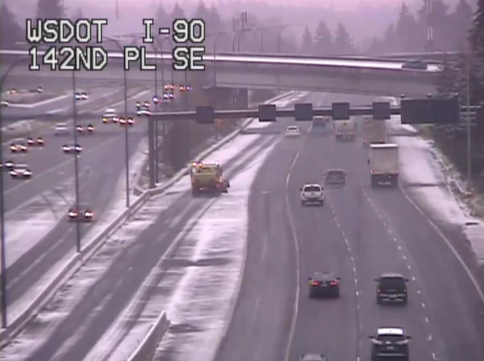 A WSDOT camera shows a plow truck along I-90 in Eastgate. 