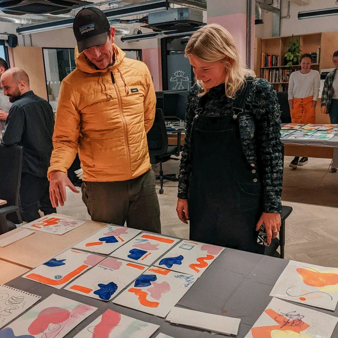Paint night at the studio. Our team admires everyone’s work laid out on our desks. 