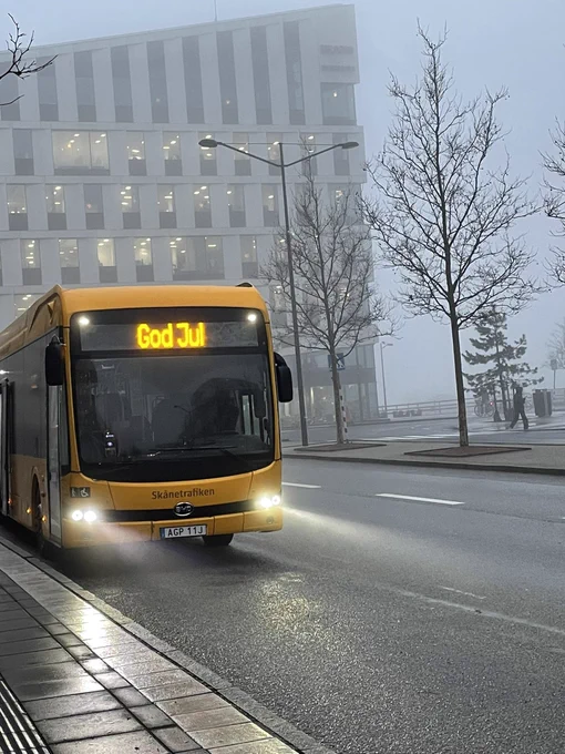 Photo shows a yellow bus with the destination board showing ‘god jul’, the Swedish words for ‘happy Christmas’