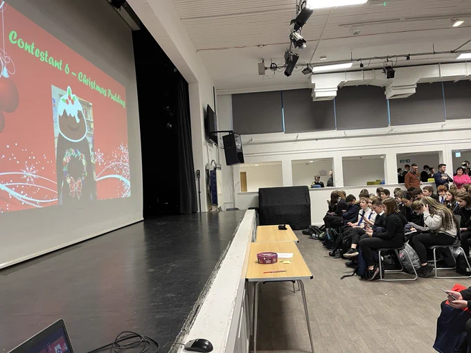 S1 pupils in the assembly hall taking part inThe Festive Masked Singer!