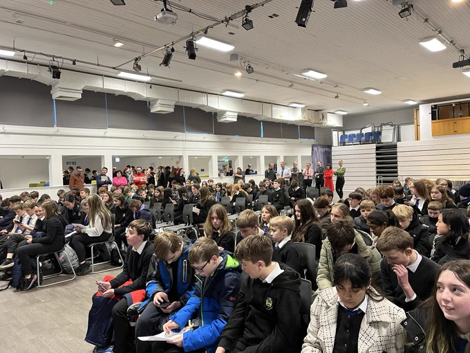 S1 pupils in the assembly hall taking part inThe Festive Masked Singer!