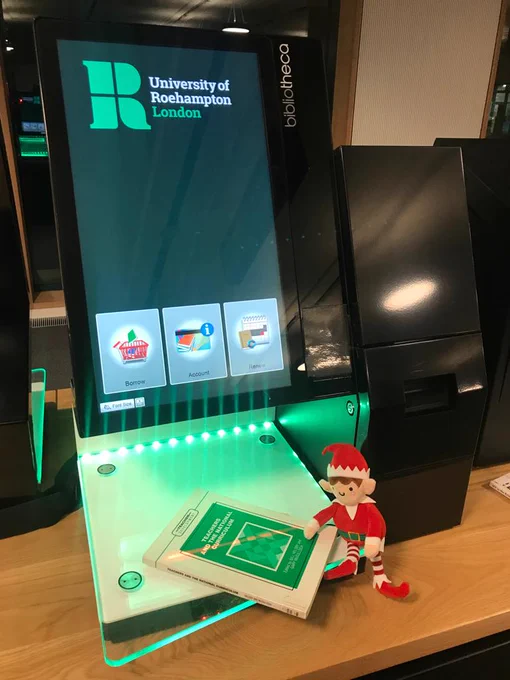 Elf borrowing a book on self-service machine