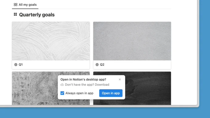 This is a Quarterly goals database in the Notion web app. At the bottom of the page is a pop-up asking the user if they want to open the page in Notion's desktop app.
