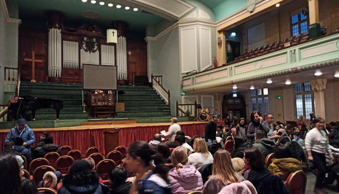 Party guests sitting in Methodist Central Hall
