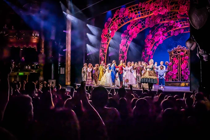 The cast of Beauty and the Beast take a bow as the crowd gives them a standing ovation.