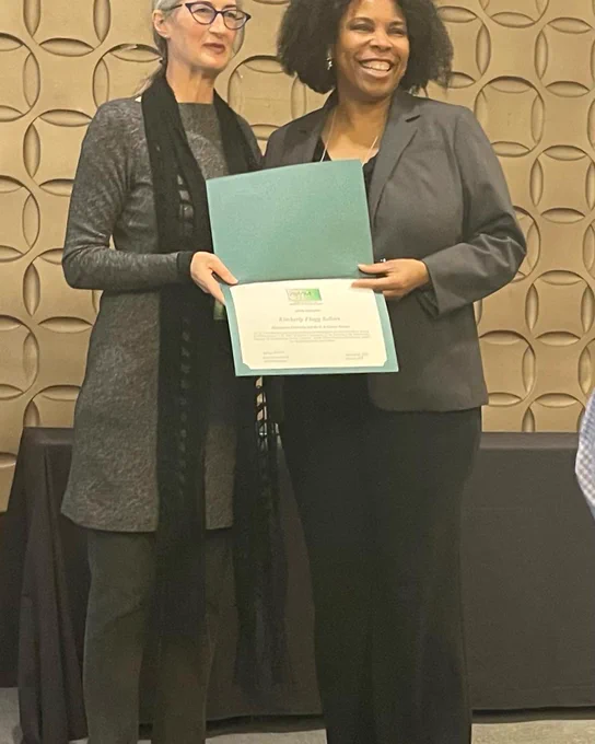Presented certificate by AWM President Kathryn Leonard