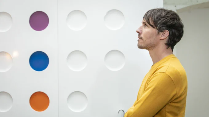 Photograph of man looking out of side on image by Orla Murray Coalesce