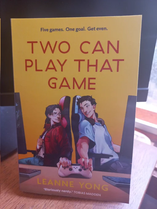 Photo shows a copy of the book 'Two Can Play That Game' by Leanne Yong